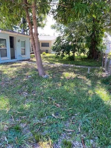 a backyard of a house with lots of green space
