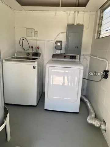 a utility room with washer and dryer