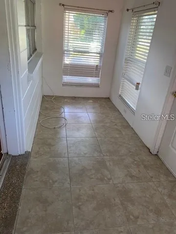 a view of an empty room and a window