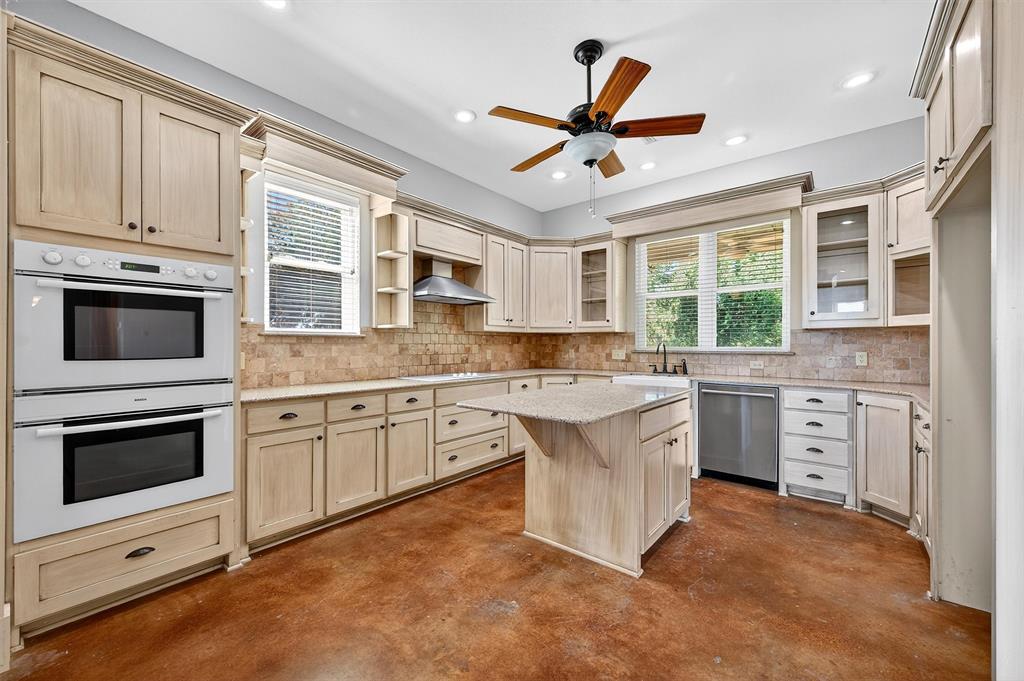 2166 Old Southmayd Road Sherman, TX 75092 - Photo 13 of 40 a kitchen with granite countertop a stove oven and a sink