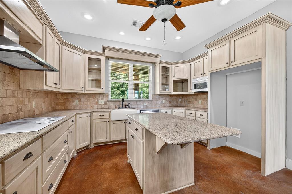 2166 Old Southmayd Road Sherman, TX 75092 - Photo 14 of 40 a kitchen with stainless steel appliances granite countertop a sink and dishwasher a stove with wooden floor