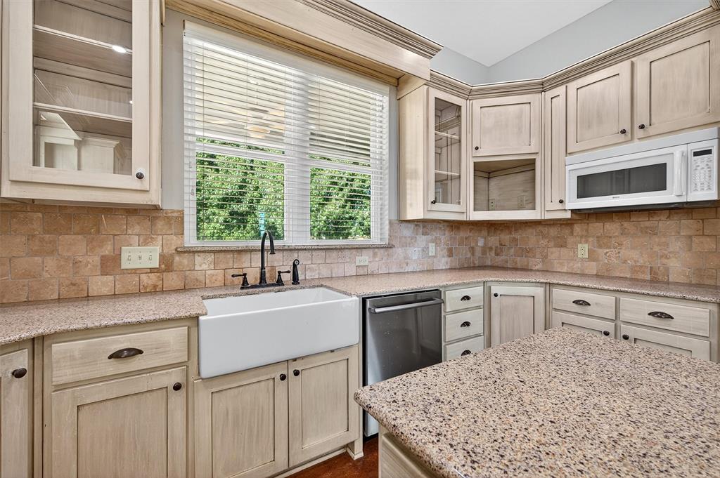 2166 Old Southmayd Road Sherman, TX 75092 - Photo 16 of 40 a kitchen with a sink stove and microwave