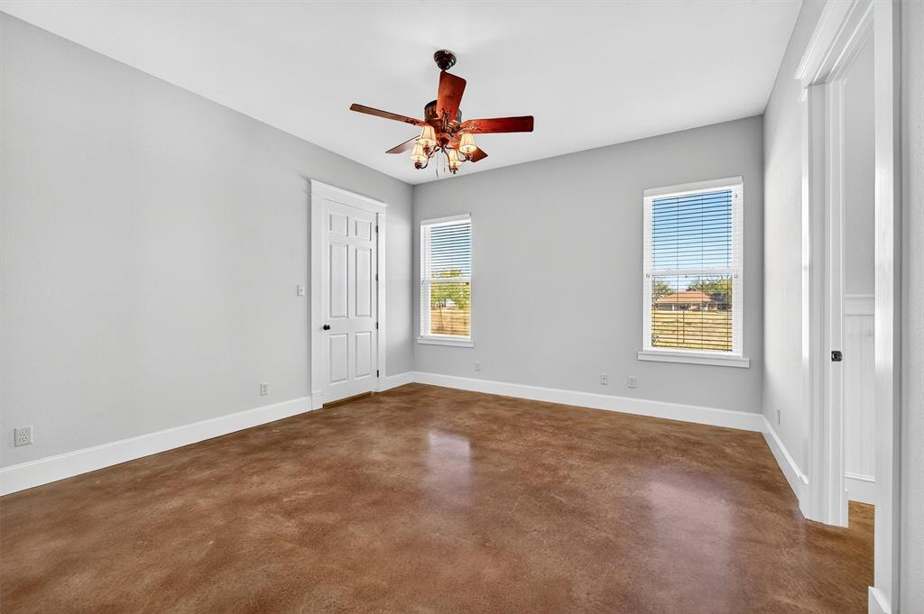 2166 Old Southmayd Road Sherman, TX 75092 - Photo 23 of 40 an empty room with windows and fan