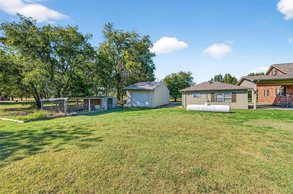 2166 Old Southmayd Road Sherman, TX 75092 - Photo 35 of 40 a front view of a house with a garden