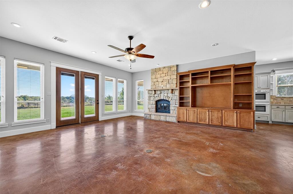 2166 Old Southmayd Road Sherman, TX 75092 - Photo 9 of 40 a view of an empty room with a fireplace and a window