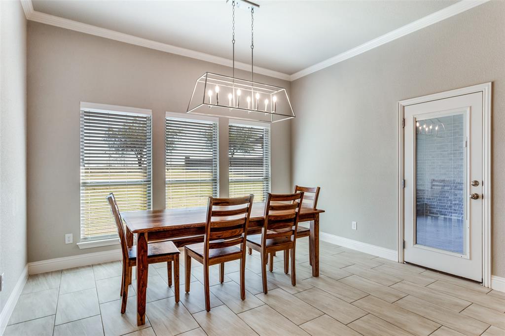 14717 Lost Wagon Street Justin, TX 76247 - Photo 15 of 37 a view of a dining room with furniture window and outside view