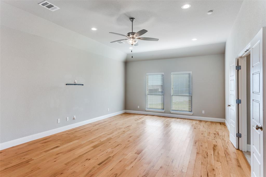 14717 Lost Wagon Street Justin, TX 76247 - Photo 17 of 37 wooden floor in an empty room with a window