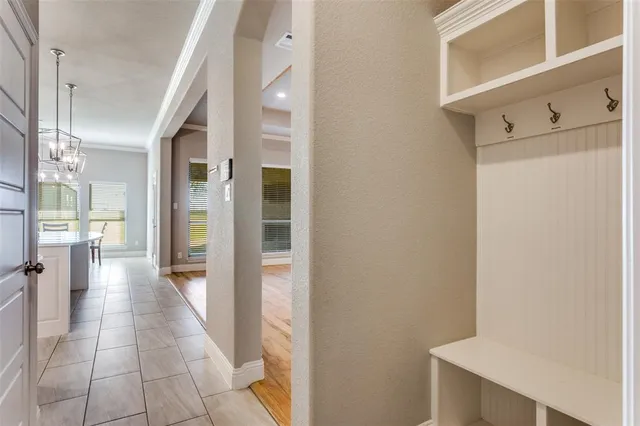 a view of a hallway with a wooden cabinets