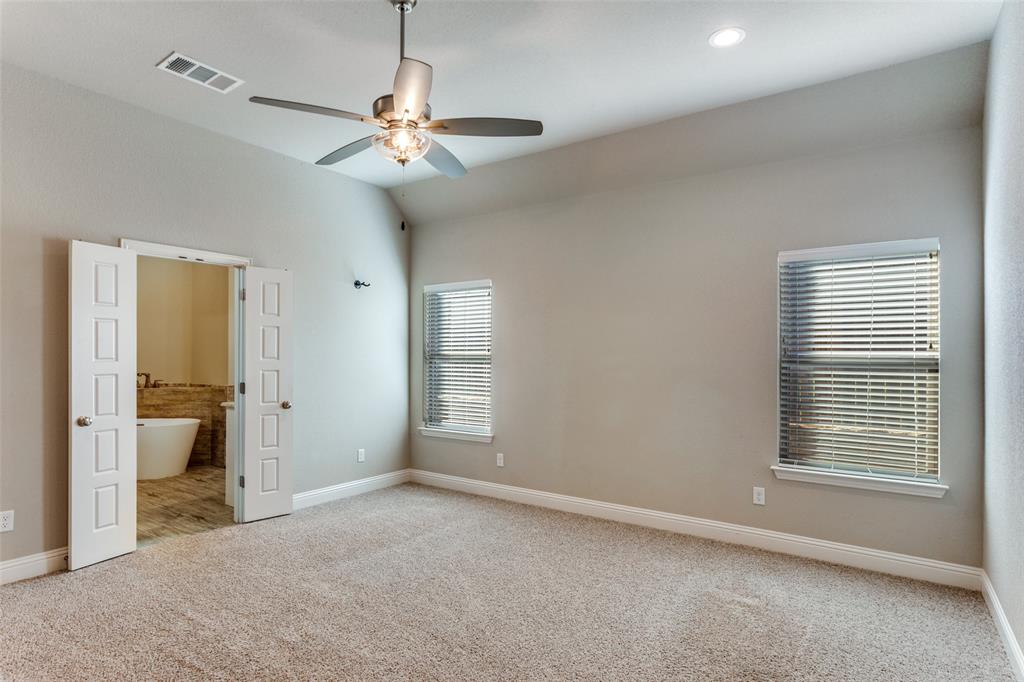 14717 Lost Wagon Street Justin, TX 76247 - Photo 22 of 37 a view of a room with a ceiling fan and window