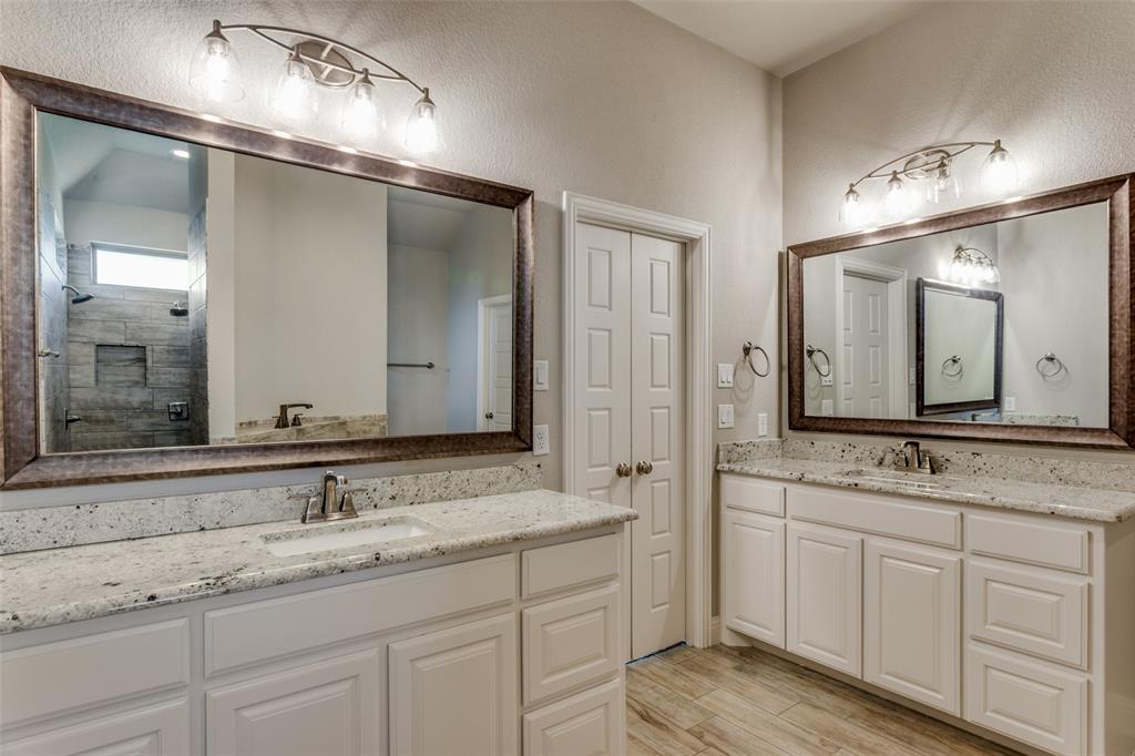14717 Lost Wagon Street Justin, TX 76247 - Photo 24 of 37 a bathroom with double sink and a mirror
