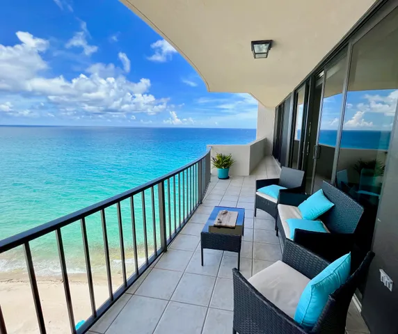 a view of balcony with furniture