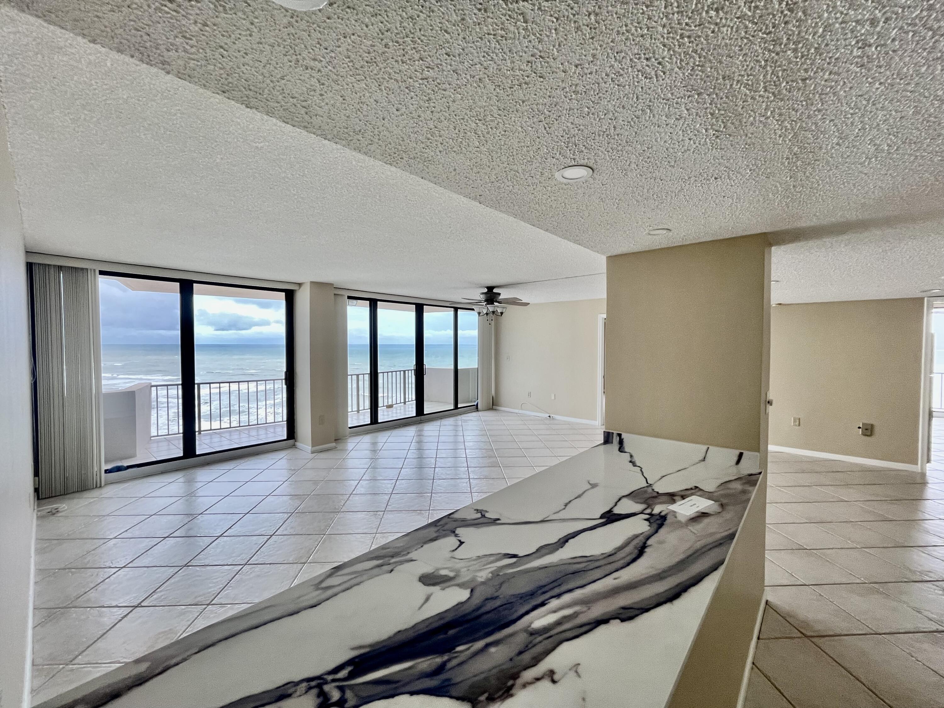 4200 North Ocean Drive, Unit 11601 Singer Island, FL 33404 - Photo 13 of 56 a large hall with stainless steel appliances granite countertop a barbecue grill and granite countertops