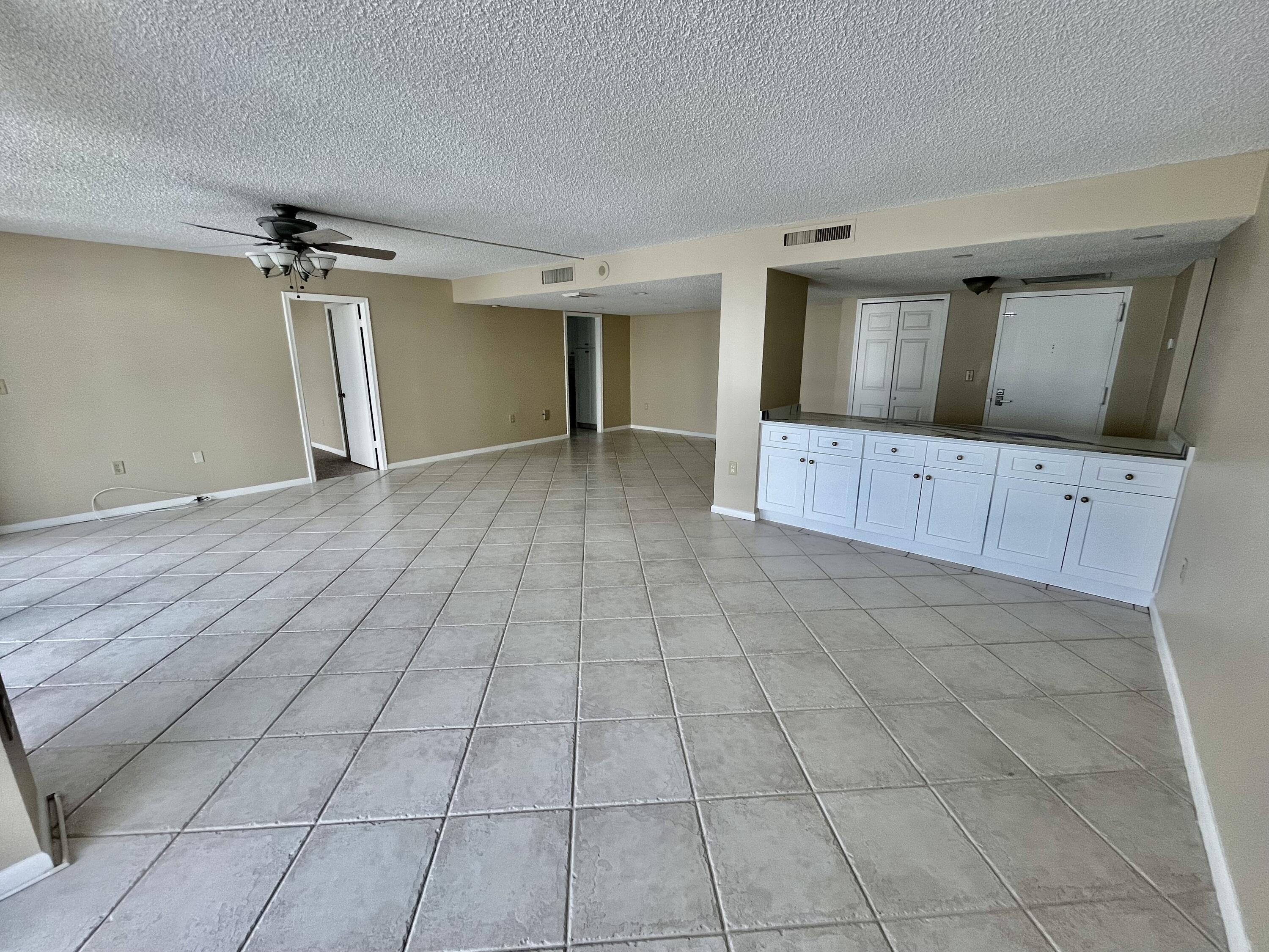 4200 North Ocean Drive, Unit 11601 Singer Island, FL 33404 - Photo 16 of 56 a view of an empty room with window and cabinet