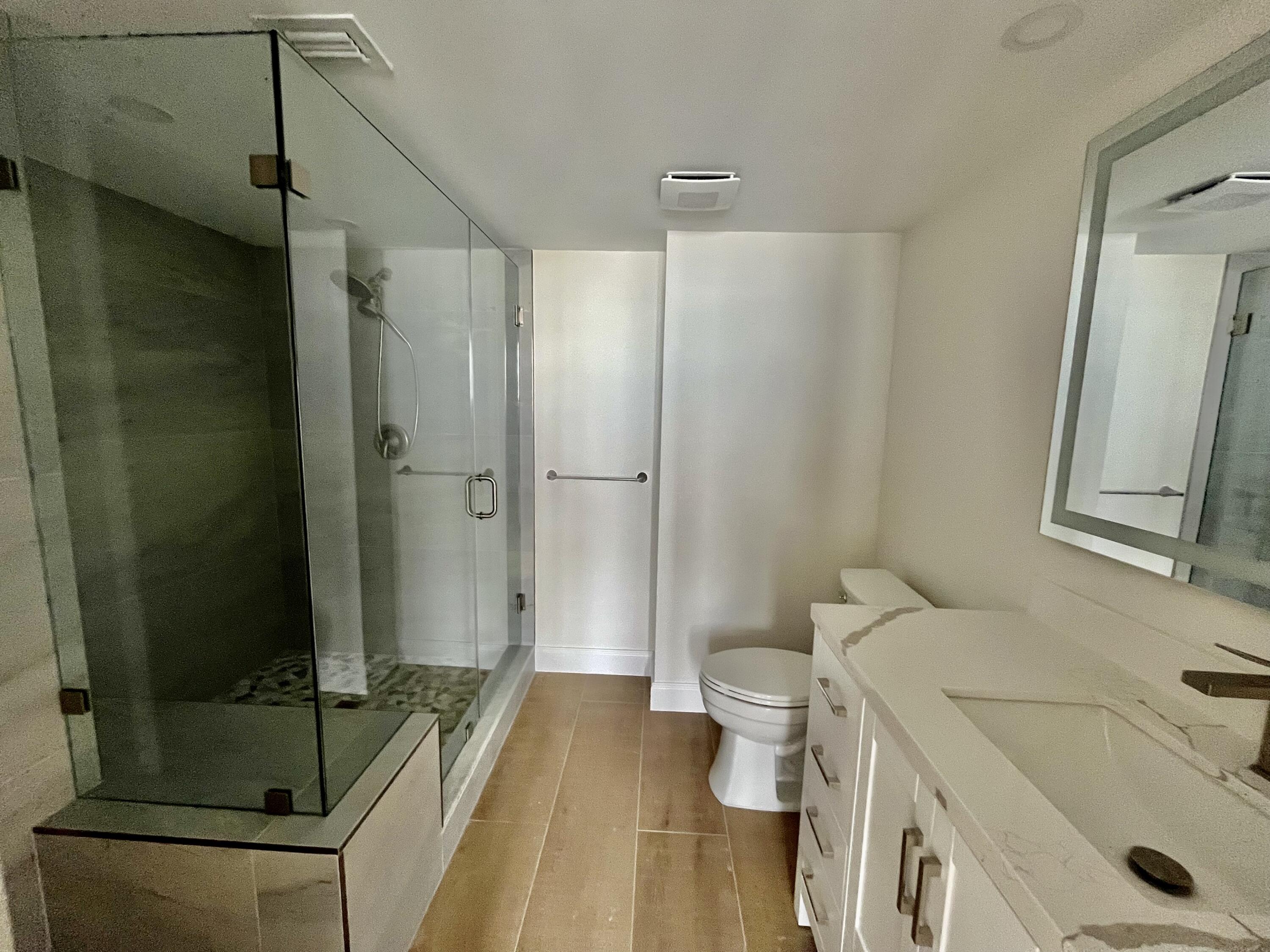 4200 North Ocean Drive, Unit 11601 Singer Island, FL 33404 - Photo 22 of 56 a bathroom with a sink toilet and shower