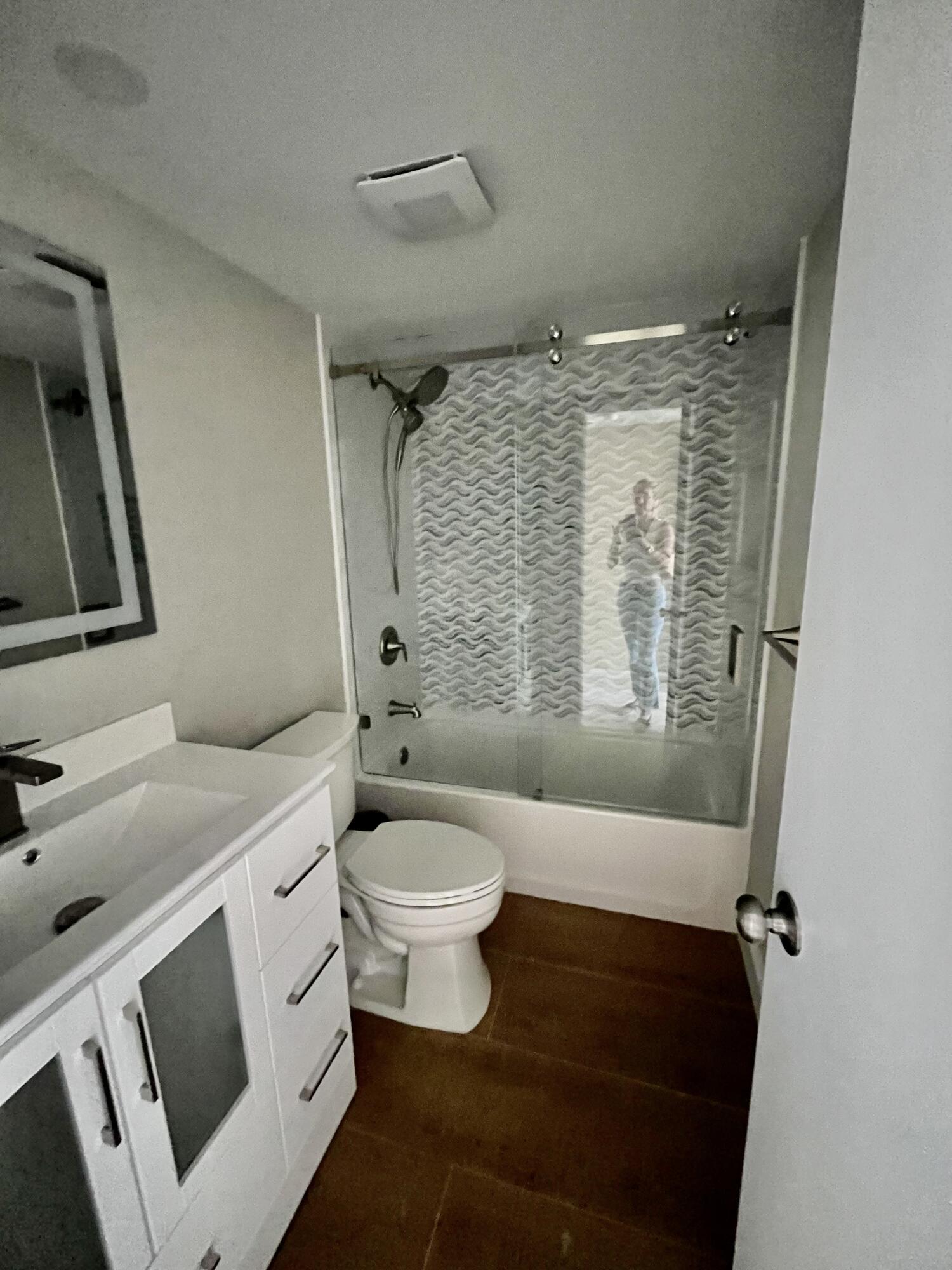 4200 North Ocean Drive, Unit 11601 Singer Island, FL 33404 - Photo 31 of 56 a bathroom with a toilet sink and shower