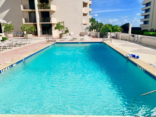 a view of a large building with a yard