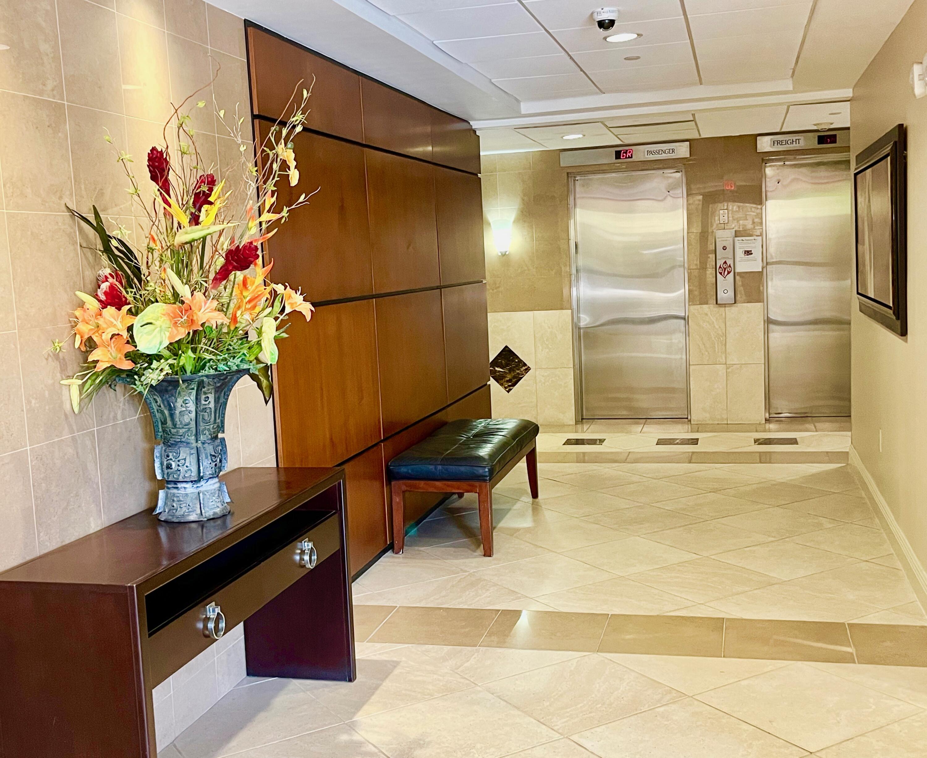 4200 North Ocean Drive, Unit 11601 Singer Island, FL 33404 - Photo 51 of 56 a swimming pool with a glass top table and chairs