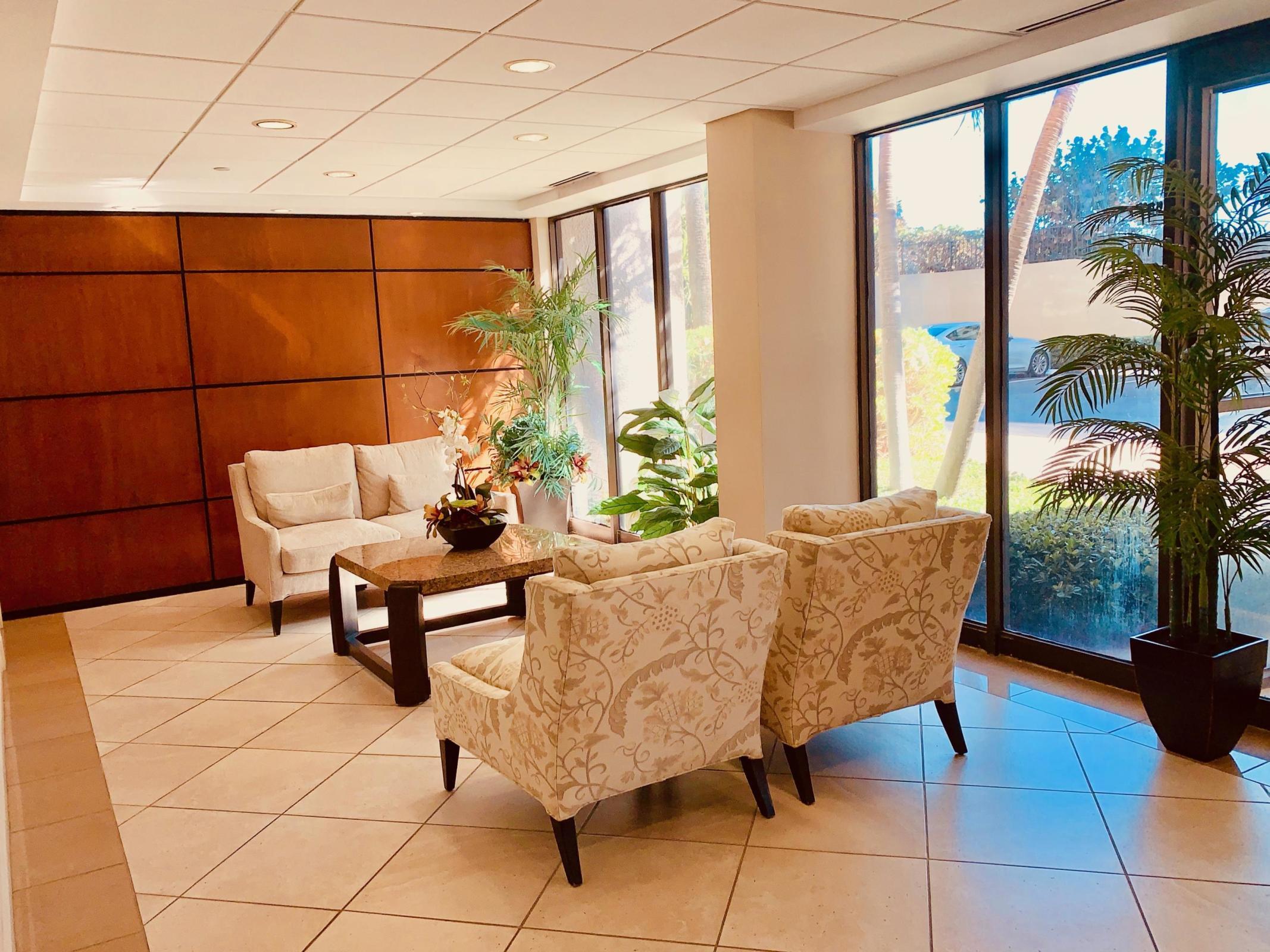 4200 North Ocean Drive, Unit 11601 Singer Island, FL 33404 - Photo 52 of 56 a living room with furniture and a floor to ceiling window