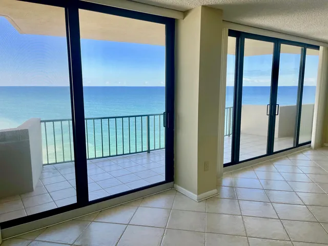 a view of balcony with a yard