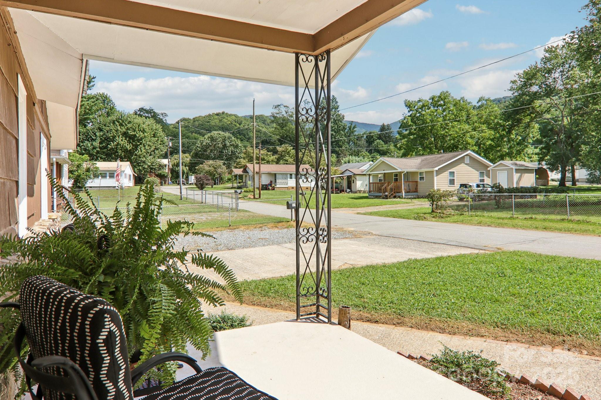 55 Polk Street Waynesville, NC 28786 - Photo 2 of 44 a view of a patio with a table chairs and a patio