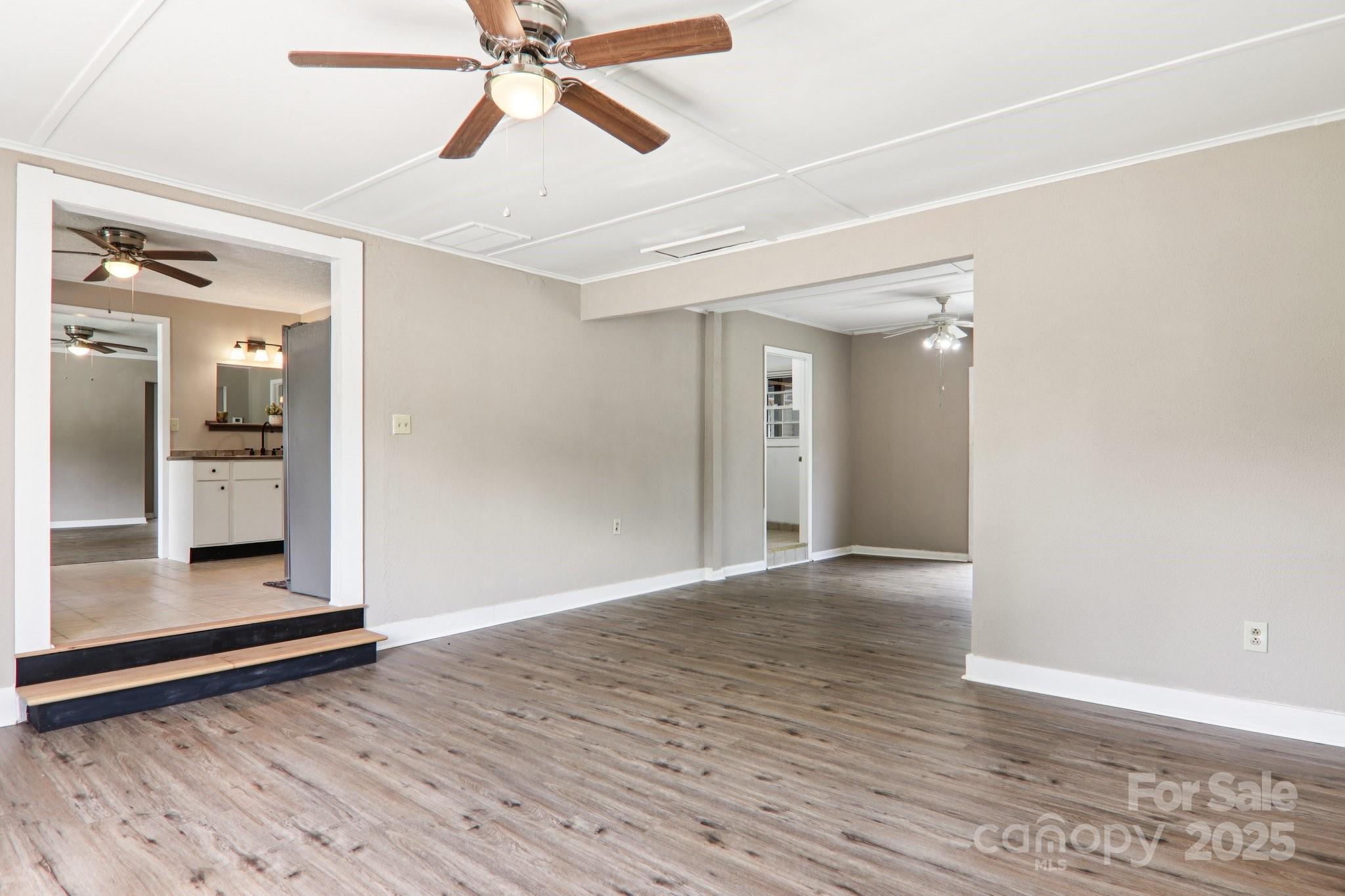 55 Polk Street Waynesville, NC 28786 - Photo 22 of 44 wooden floor in an empty room with a window