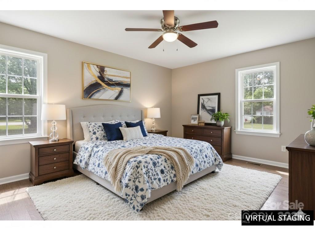 55 Polk Street Waynesville, NC 28786 - Photo 25 of 44 a bedroom with a bed chandelier and a window