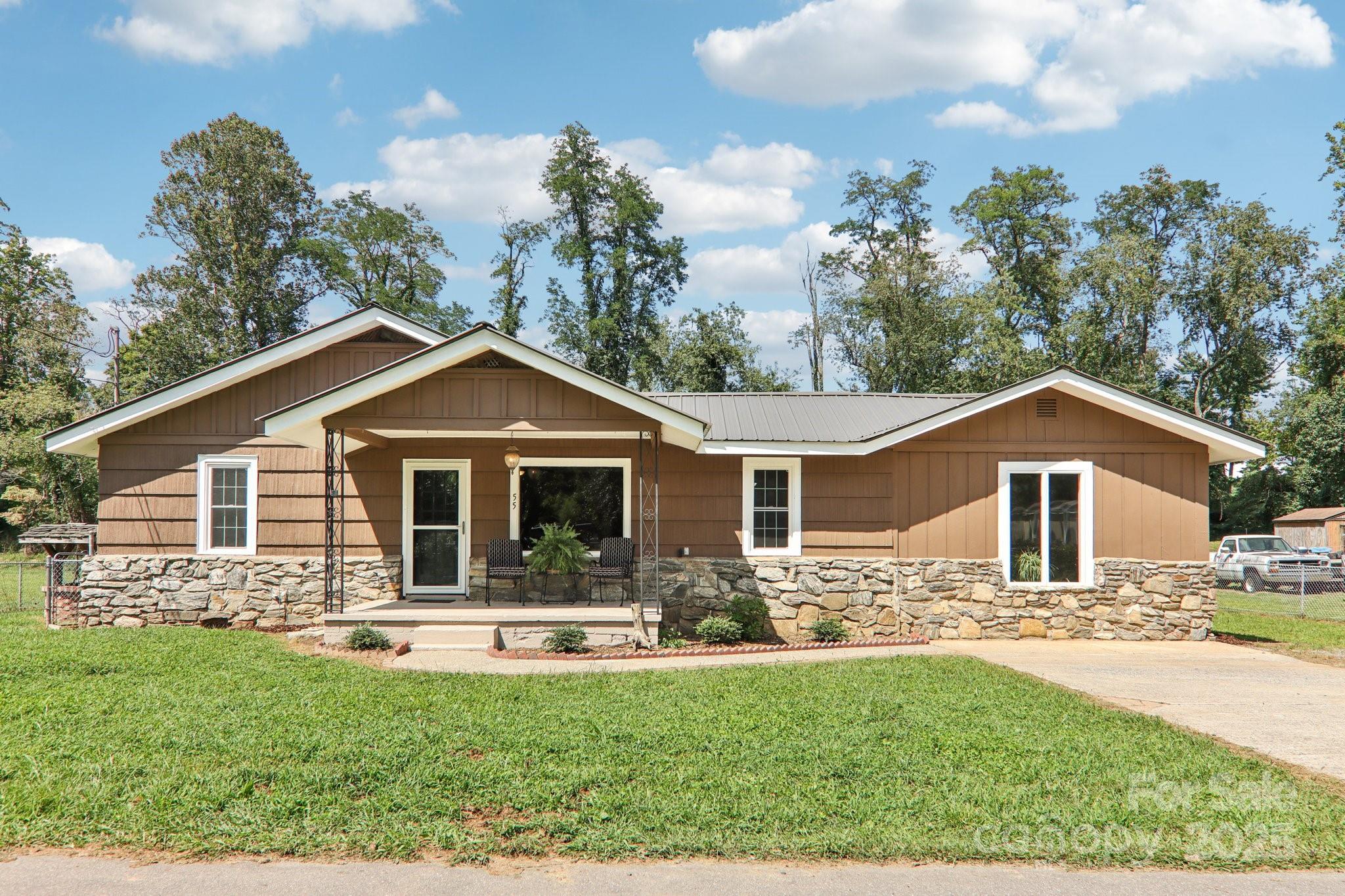 55 Polk Street Waynesville, NC 28786 - Photo 3 of 44 a front view of house with yard and green space