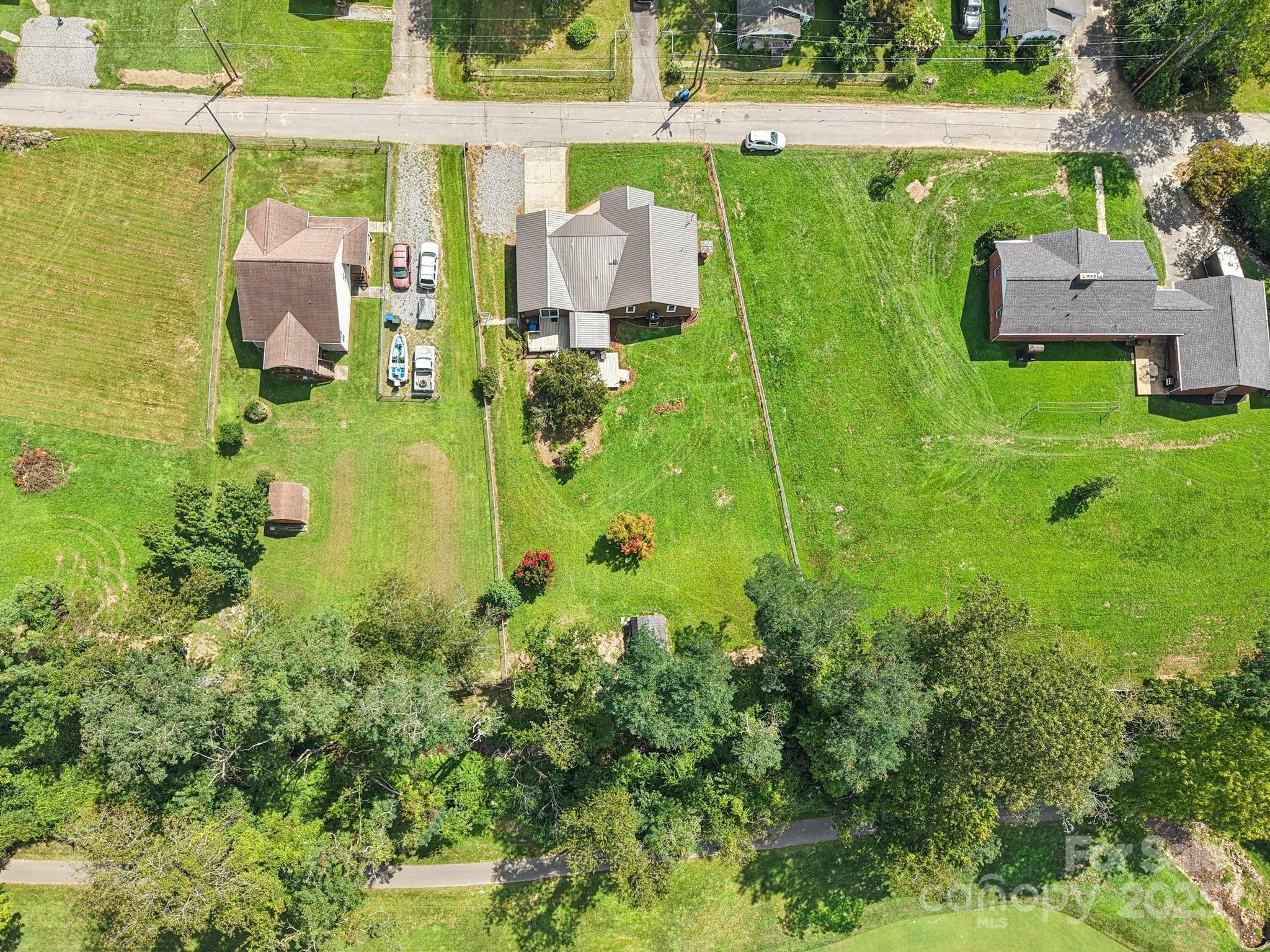 55 Polk Street Waynesville, NC 28786 - Photo 32 of 44 an aerial view of residential houses with outdoor space and trees
