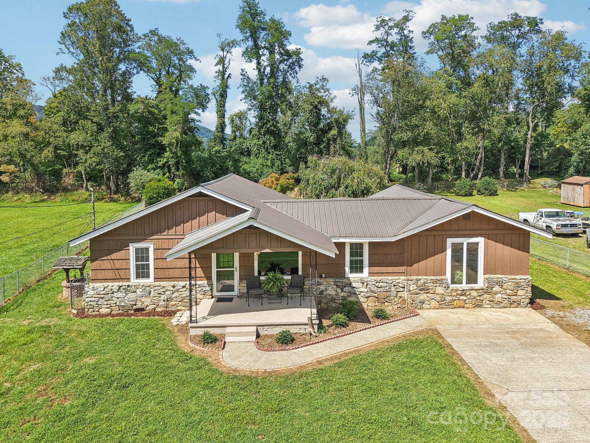 55 Polk Street Waynesville, NC 28786 - Photo 36 of 44 a front view of a house with a yard