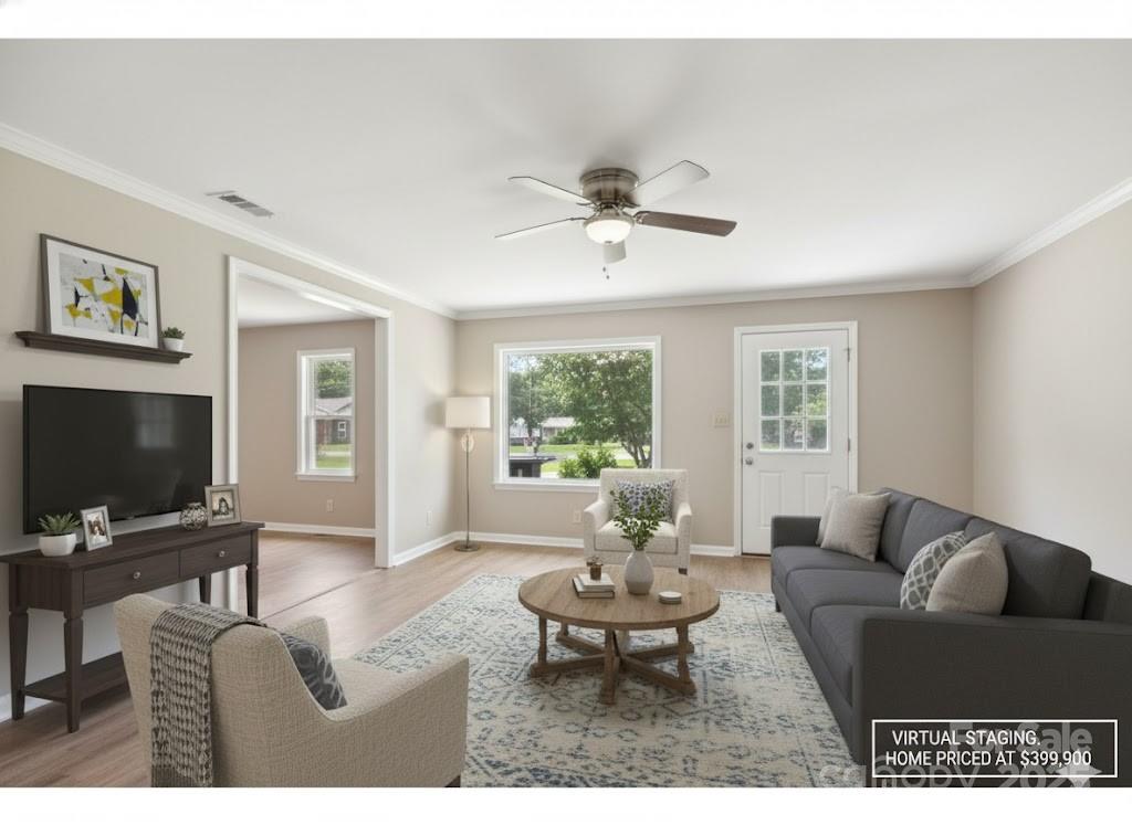 55 Polk Street Waynesville, NC 28786 - Photo 8 of 44 a living room with furniture a window and a flat screen tv