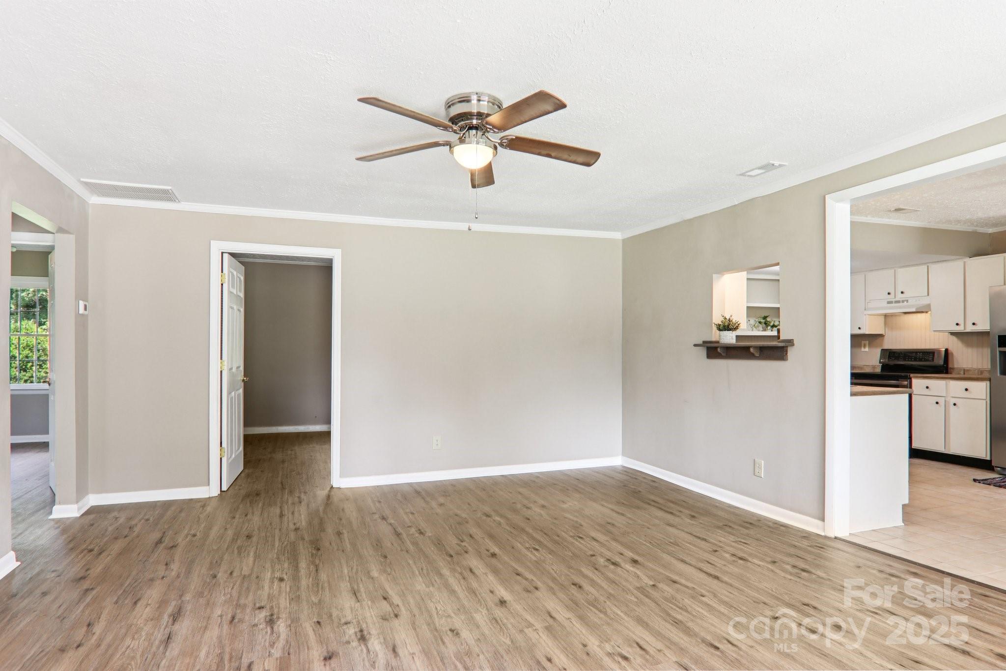 55 Polk Street Waynesville, NC 28786 - Photo 9 of 44 a view of empty room with wooden floor