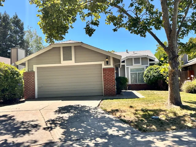 a house view with a backyard space