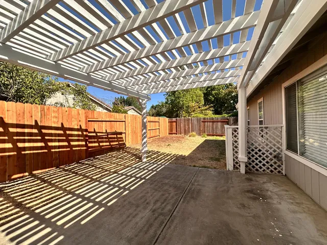 a view of porch with wooden floor