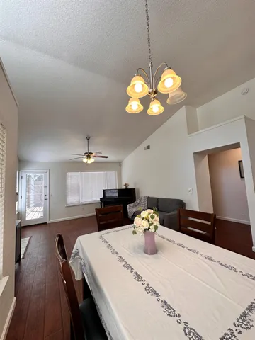 a kitchen with a table and chairs in it