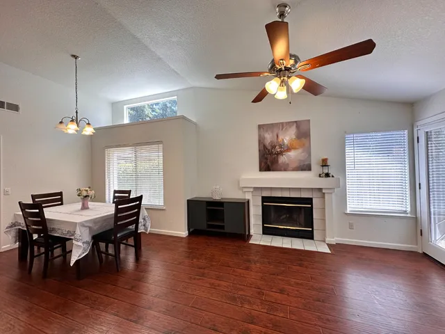 a view of a dining room with furniture window and wooden floor