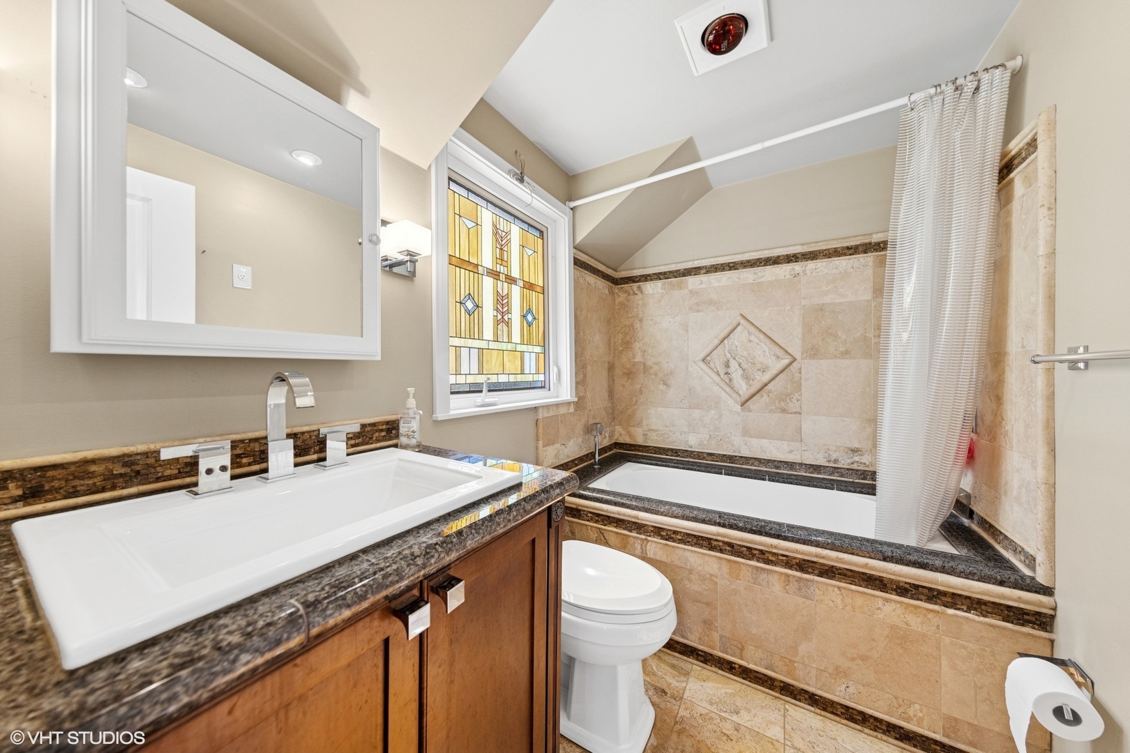 424 Hill Street Downers Grove, IL 60515 - Photo 9 of 19 a bathroom with a granite countertop sink a mirror a bathtub and next to a window