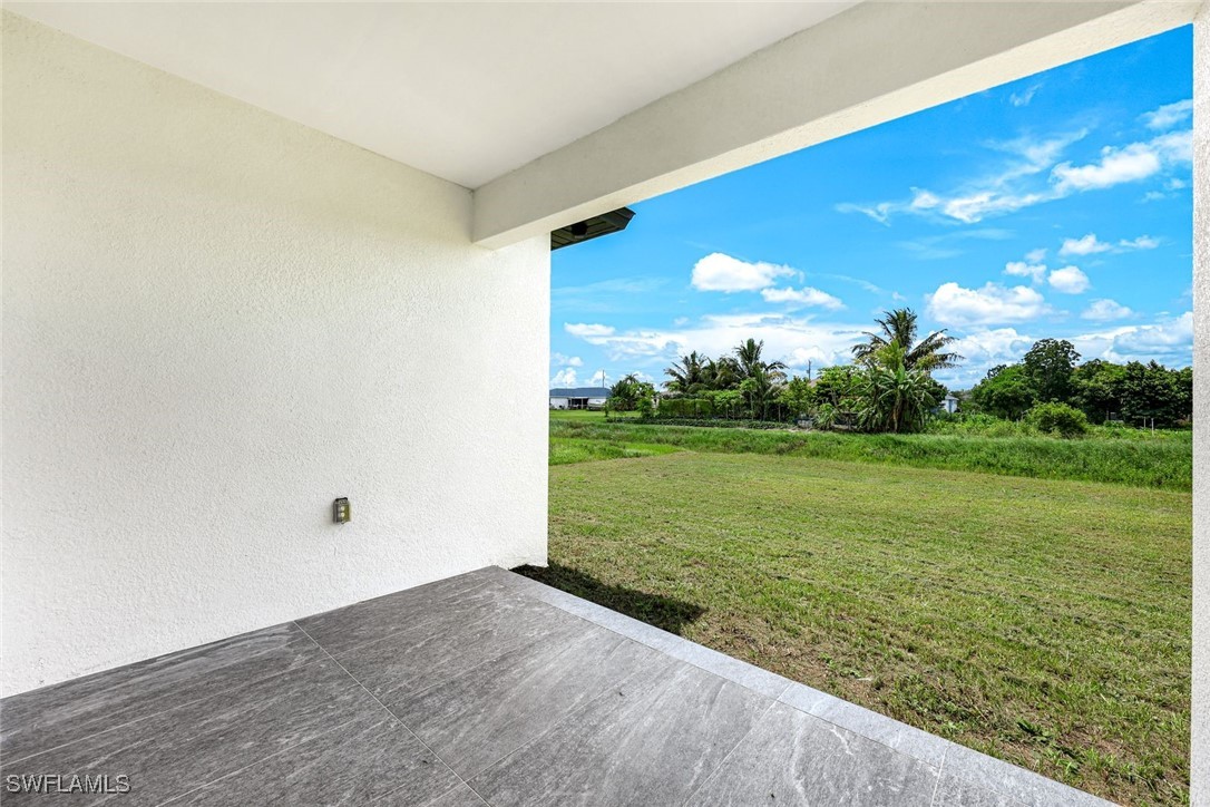 147 Partridge Street Lehigh Acres, FL 33974 - Photo 18 of 20 a view of an outdoor space and yard