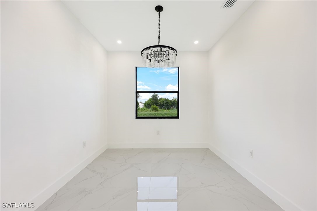147 Partridge Street Lehigh Acres, FL 33974 - Photo 10 of 20 an empty room with window