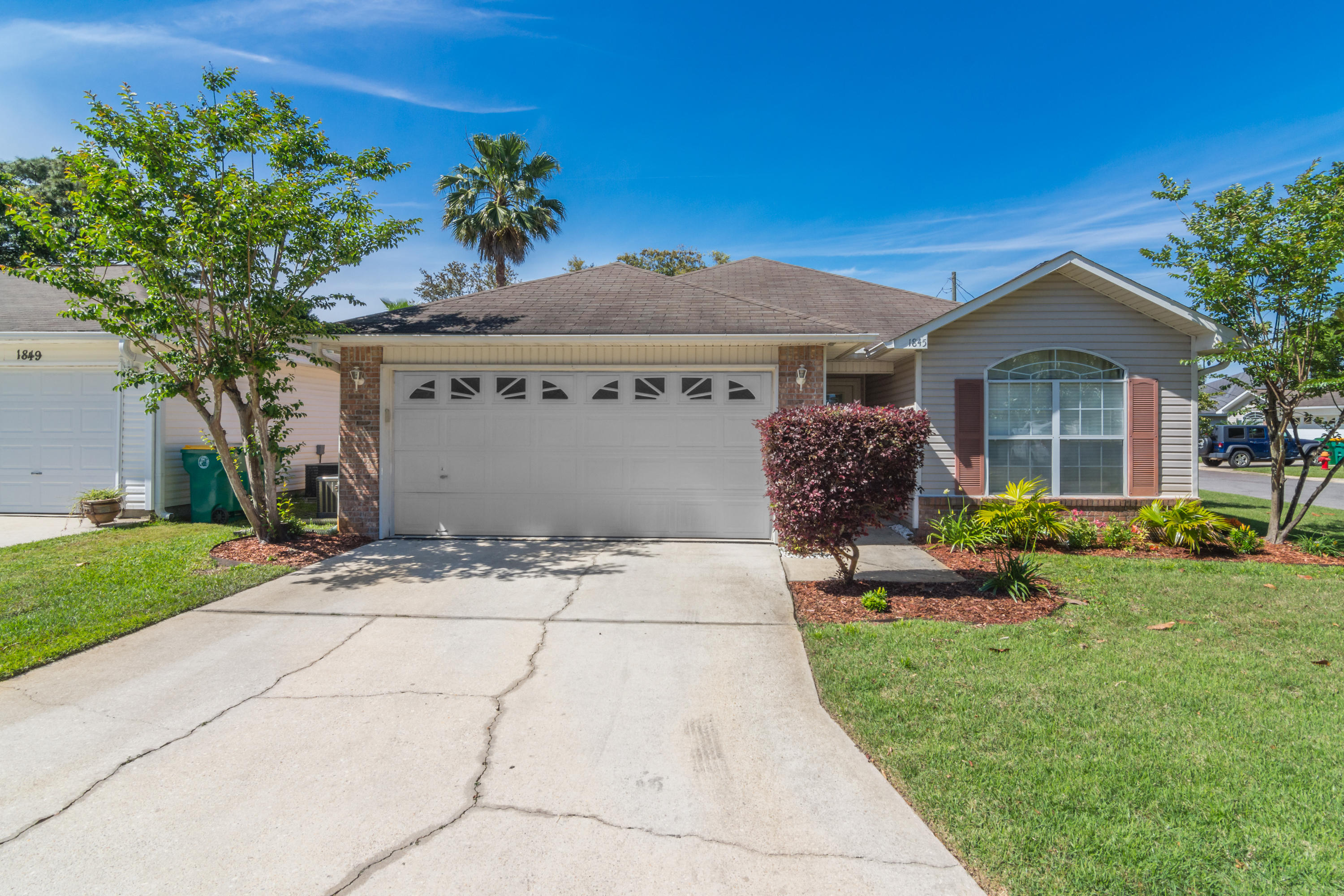 1845 Brick Circle Fort Walton Beach, FL 32547 - Photo 1 of 24 a front view of a house with a garden