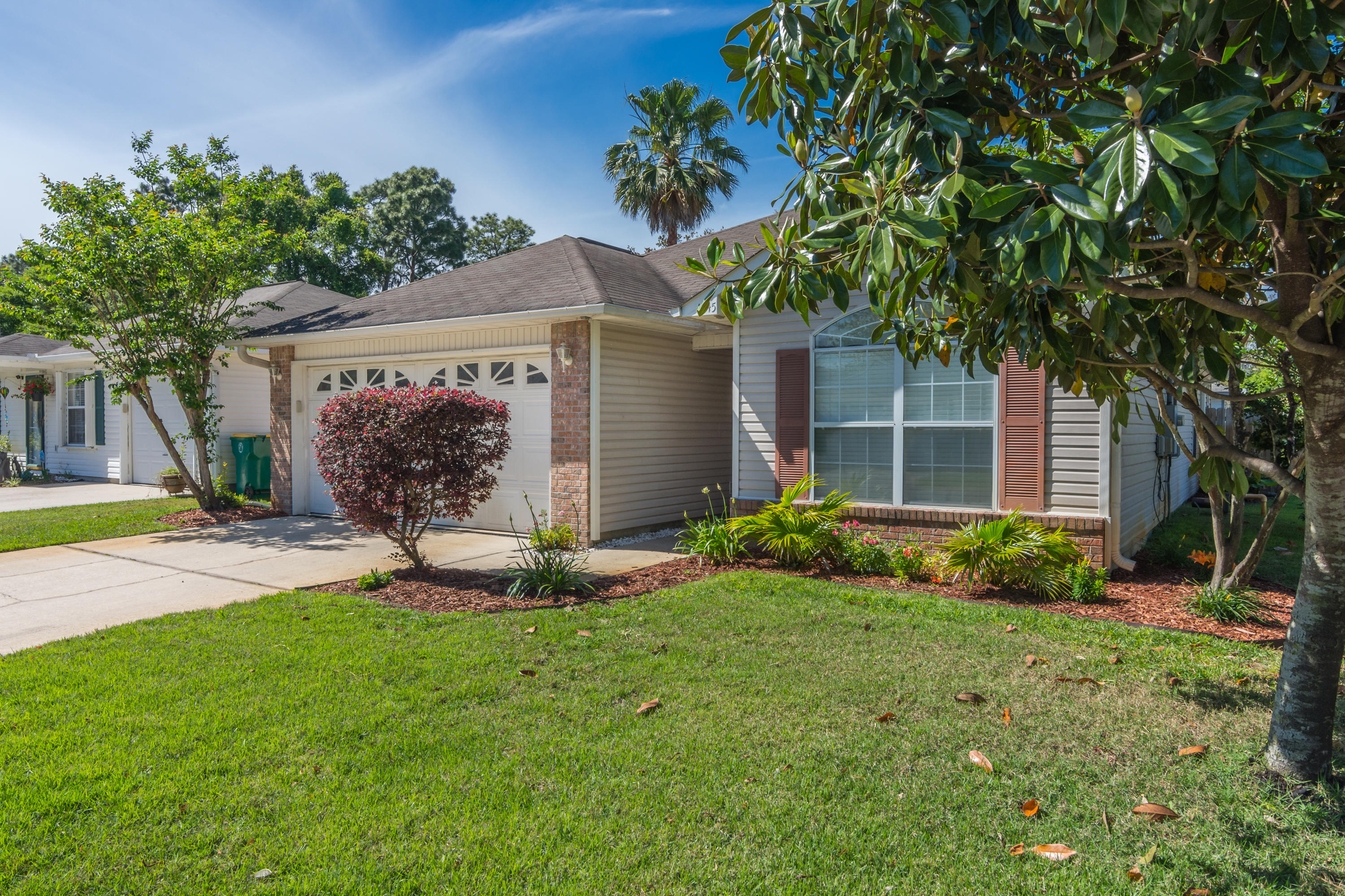 1845 Brick Circle Fort Walton Beach, FL 32547 - Photo 2 of 24 a front view of house with yard and green space