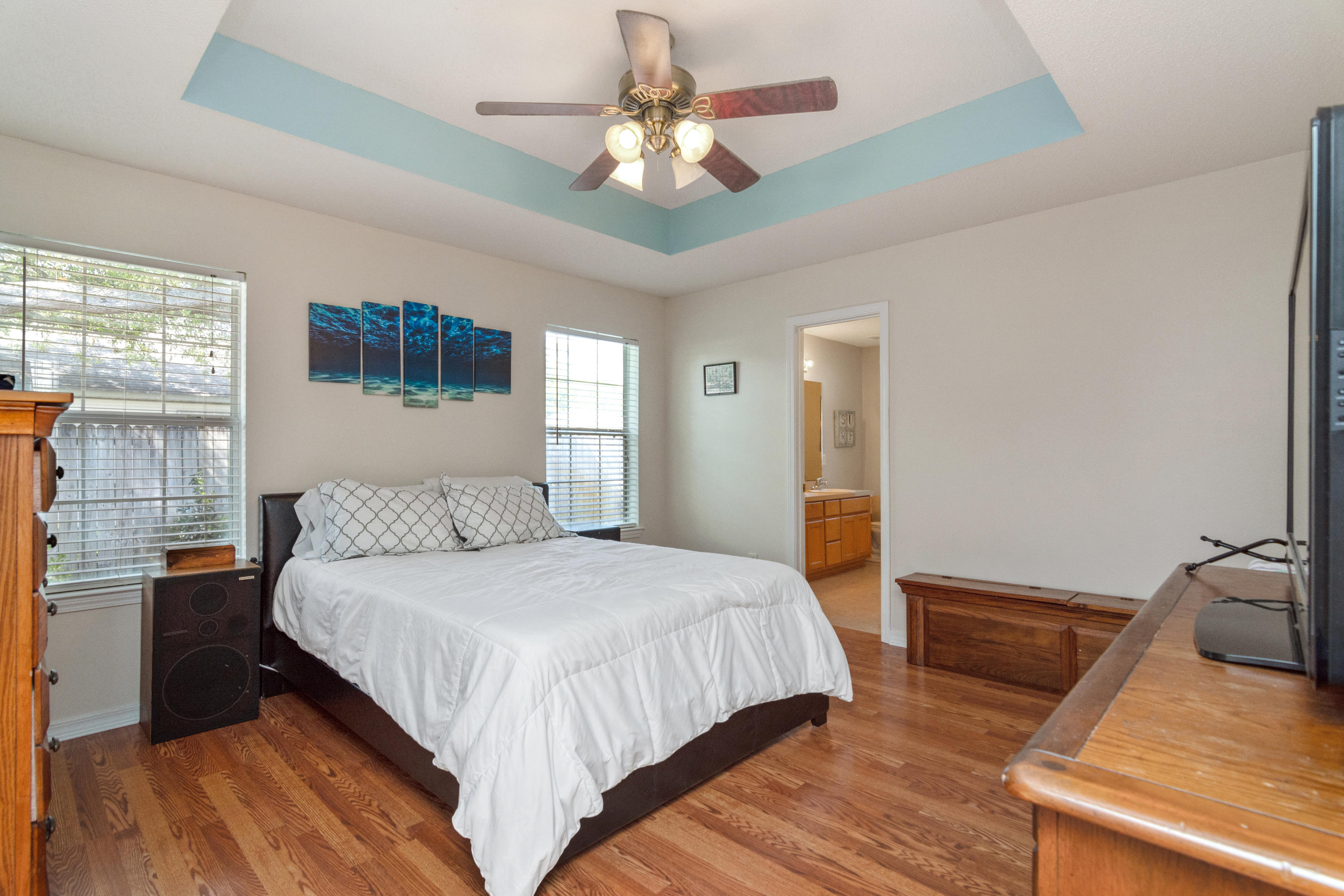 1845 Brick Circle Fort Walton Beach, FL 32547 - Photo 11 of 24 a bedroom with a bed and a chandelier