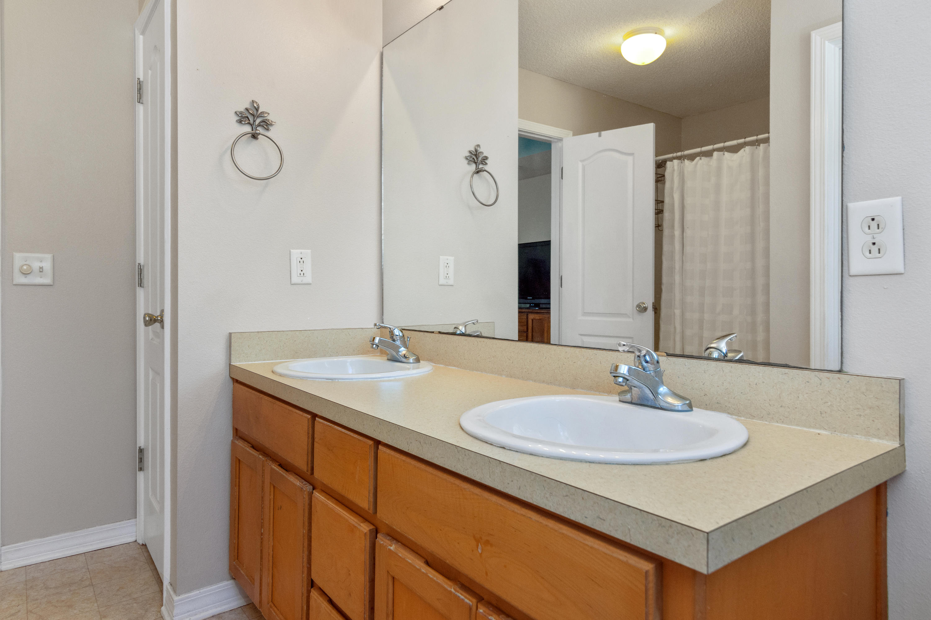 1845 Brick Circle Fort Walton Beach, FL 32547 - Photo 16 of 24 a bathroom with a sink and a mirror