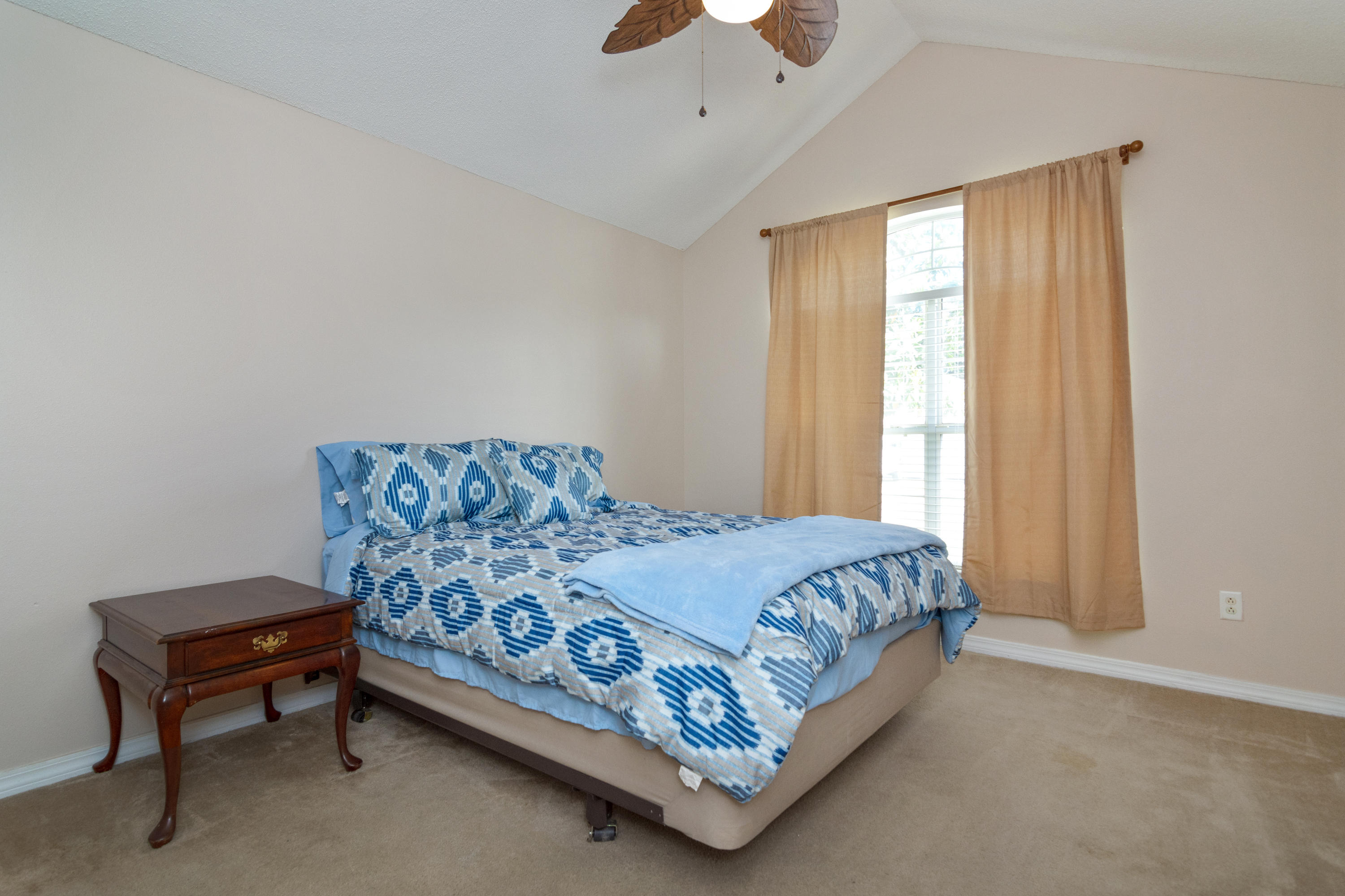 1845 Brick Circle Fort Walton Beach, FL 32547 - Photo 17 of 24 a bed sitting in a bedroom next to a window