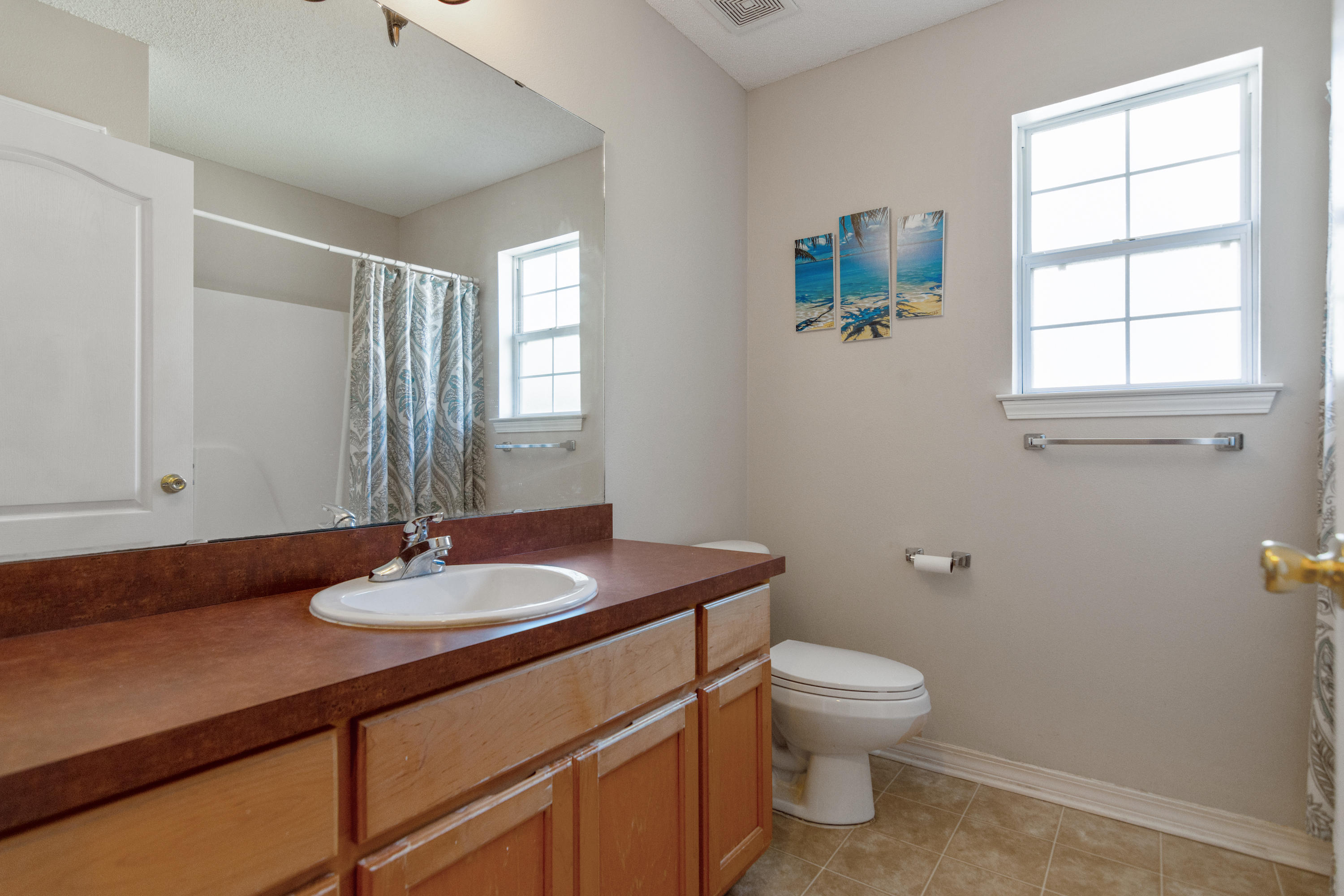1845 Brick Circle Fort Walton Beach, FL 32547 - Photo 18 of 24 a bathroom with a sink toilet and a window