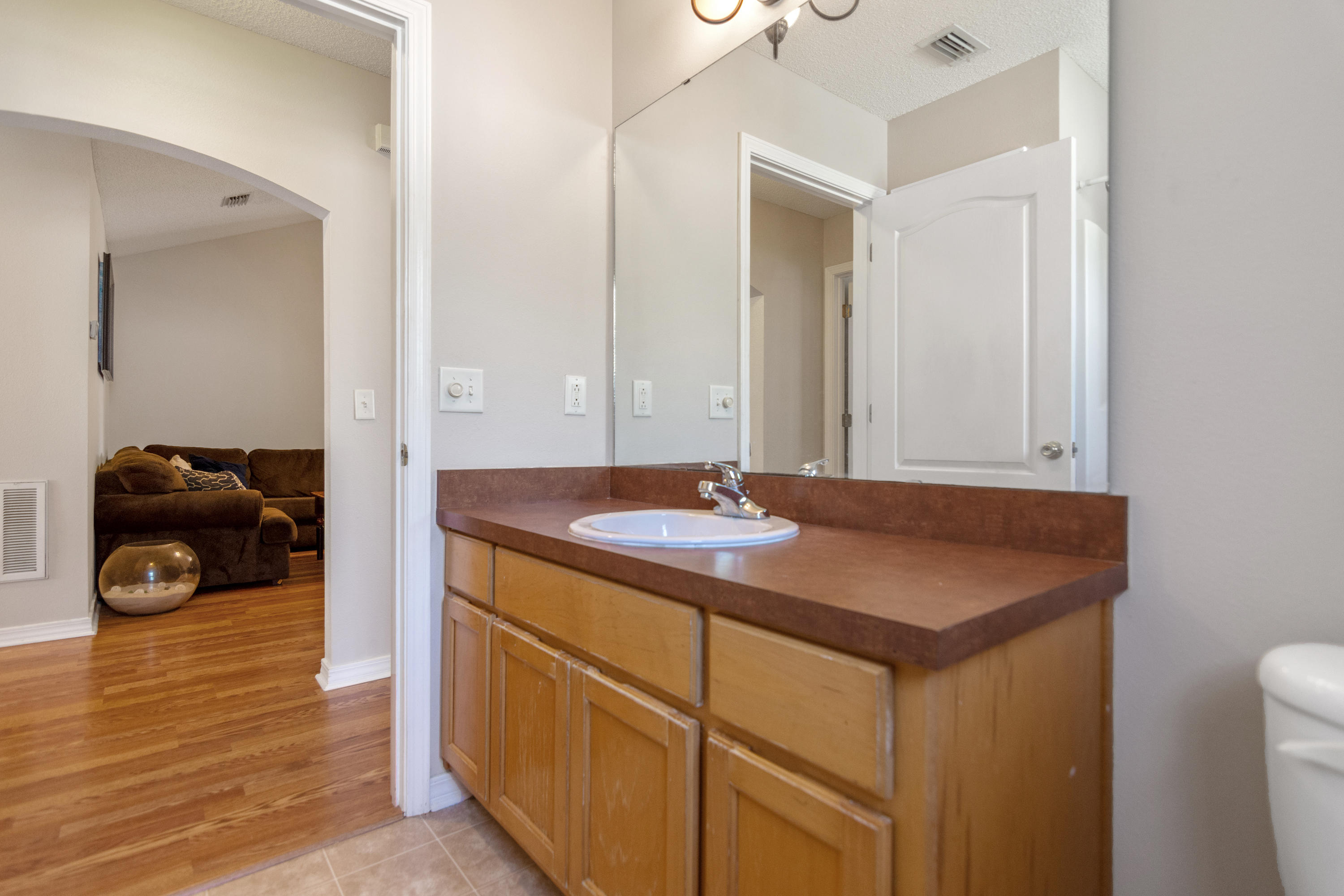 1845 Brick Circle Fort Walton Beach, FL 32547 - Photo 21 of 24 a bathroom with a sink and a mirror