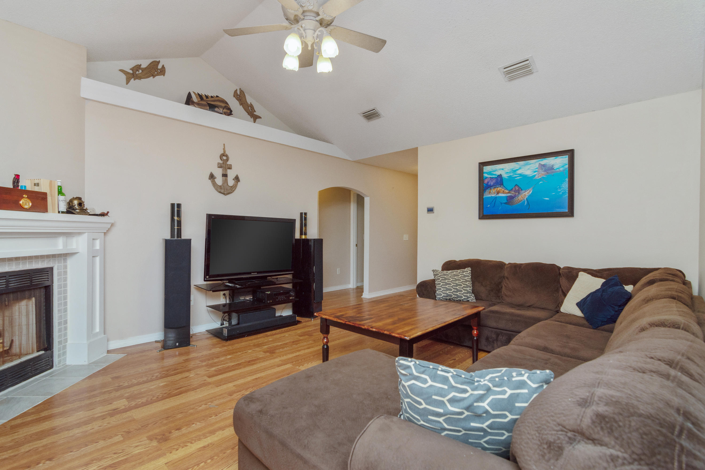 1845 Brick Circle Fort Walton Beach, FL 32547 - Photo 4 of 24 a living room with furniture and a flat screen tv