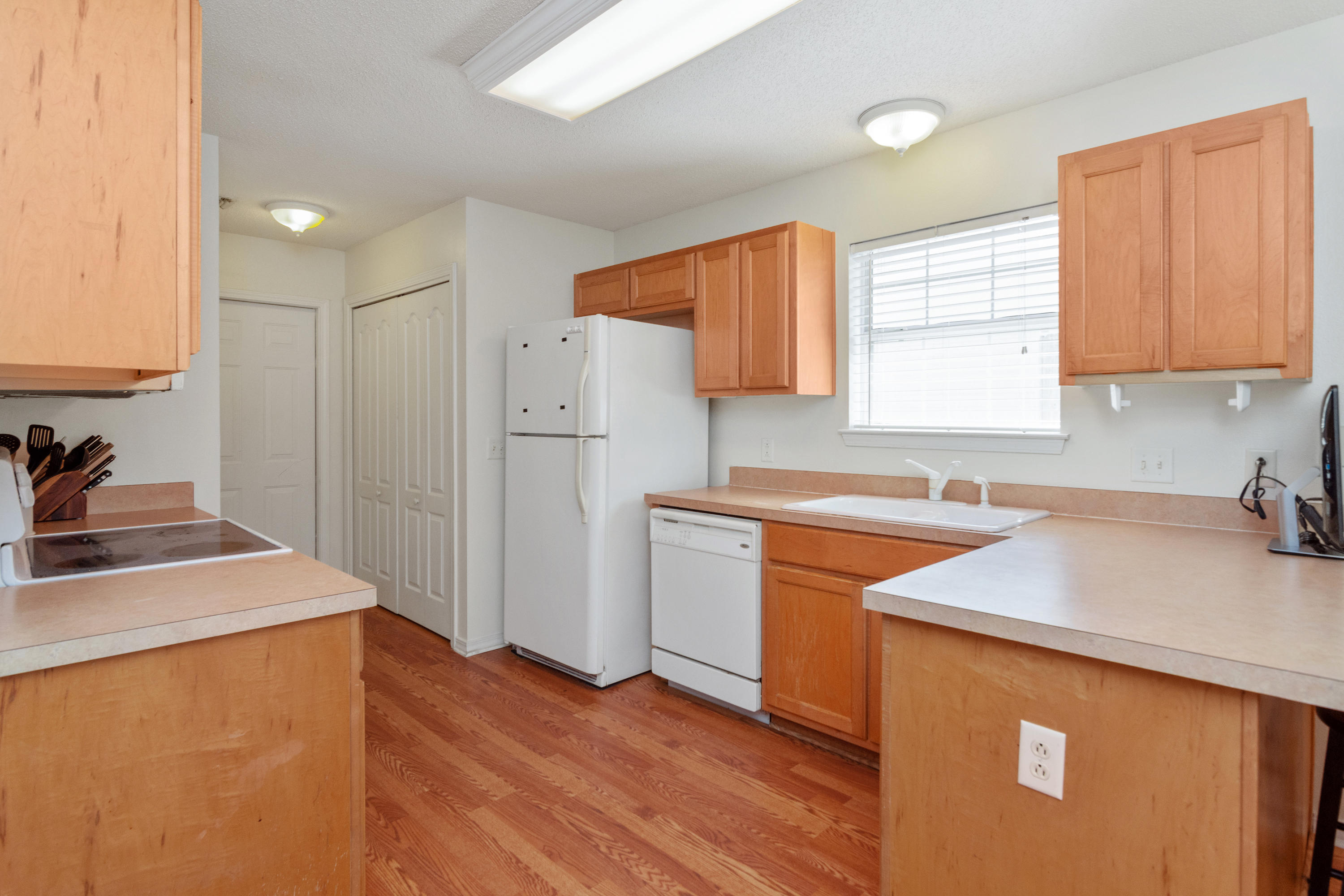 1845 Brick Circle Fort Walton Beach, FL 32547 - Photo 6 of 24 a kitchen with a sink a stove a refrigerator and a window