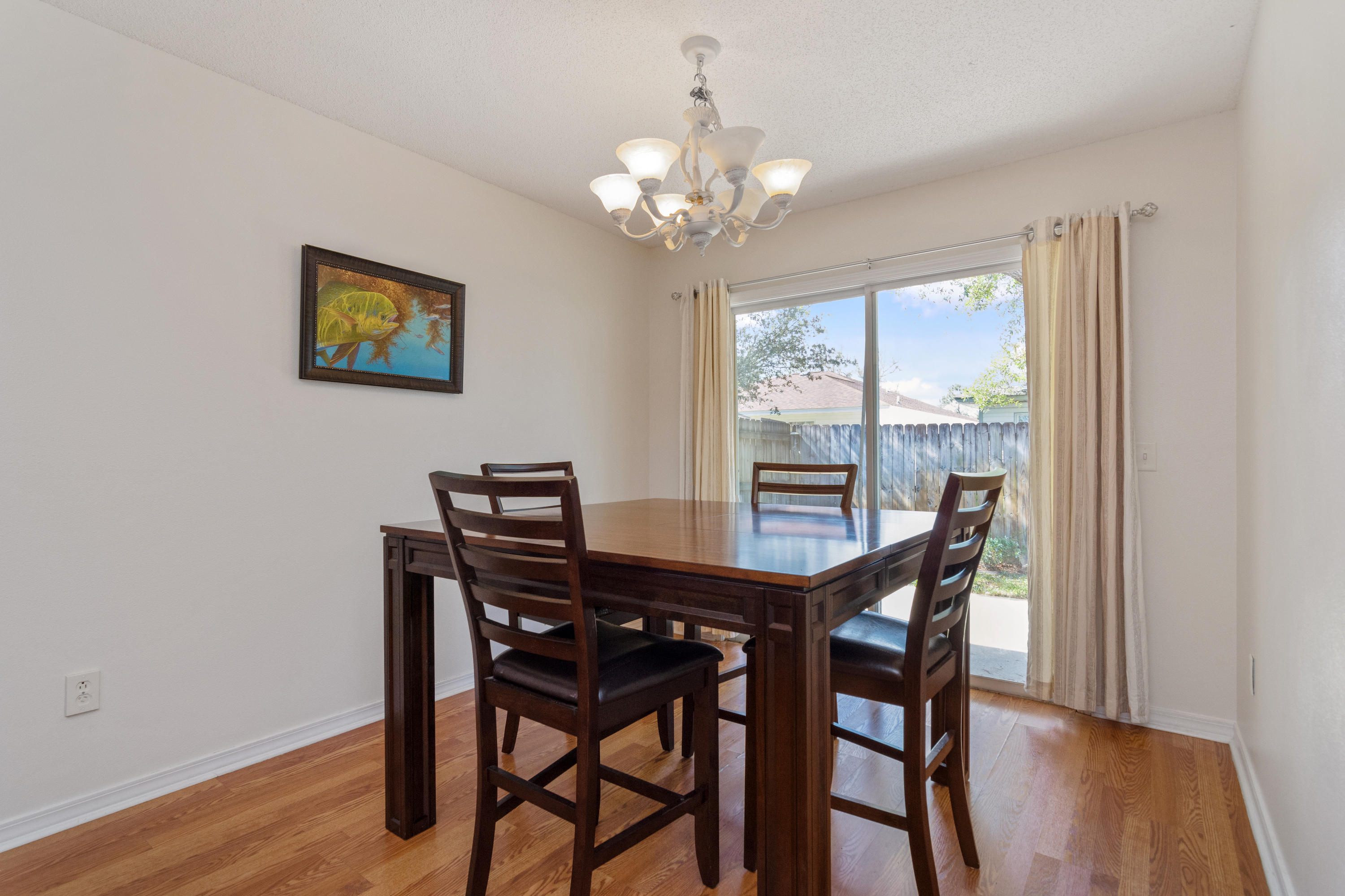 1845 Brick Circle Fort Walton Beach, FL 32547 - Photo 10 of 24 a view of a dining room with furniture and wooden floor