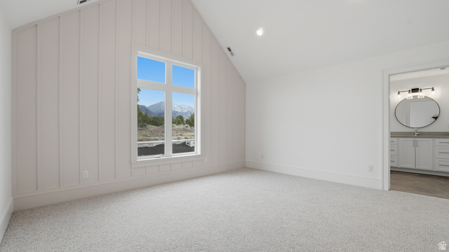 1682 North 1950 W Street, Unit 9 Provo, UT 84604 - Photo 58 of 84 Spacious room featuring vaulted ceilings, board and batten wall detailing, and a large picture window
