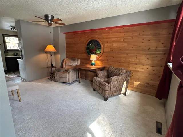 a bed room with furniture and lamp